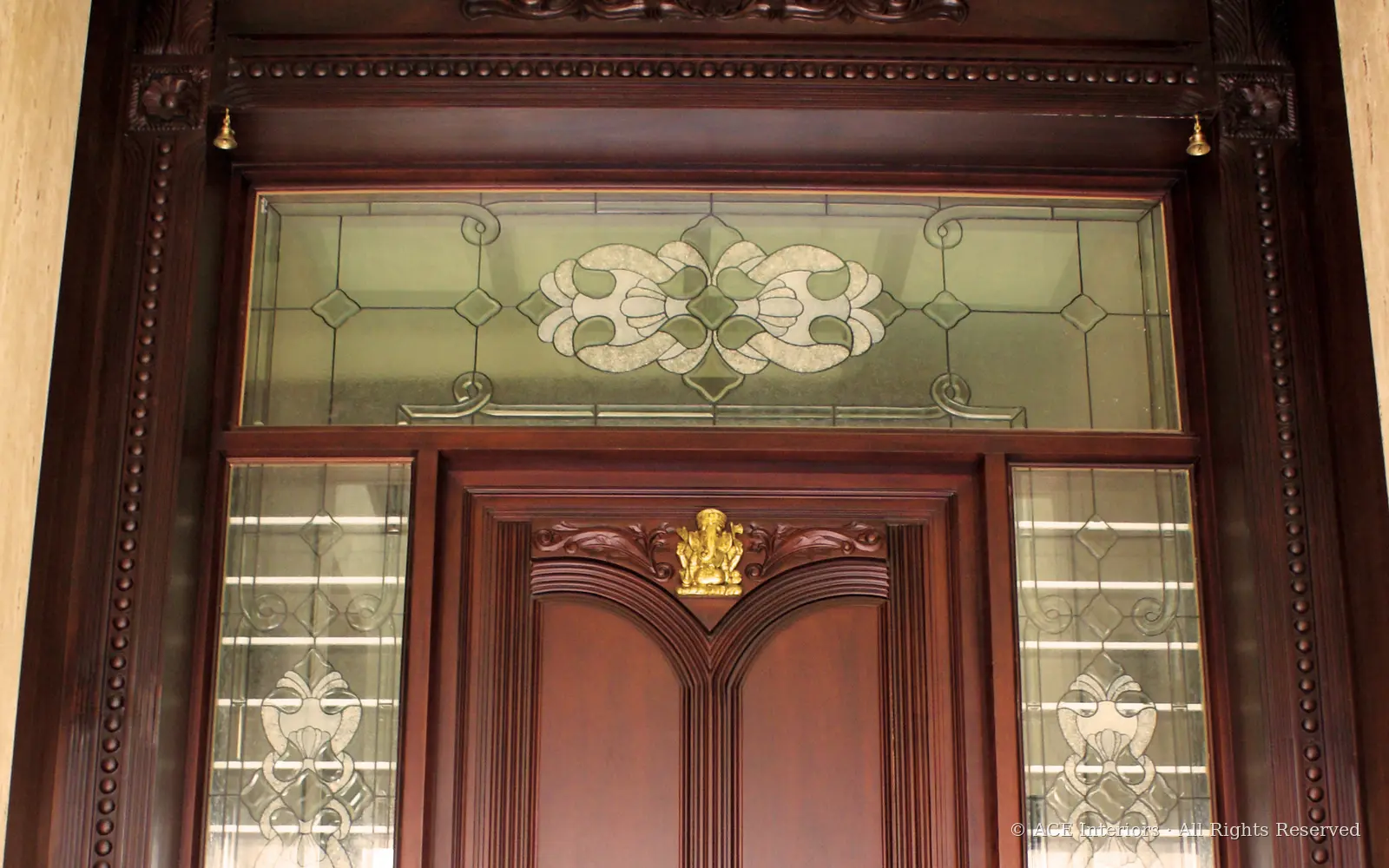 The Carved Threshold — Traditional teak entrance, interior design by ACE Interiors, Chennai